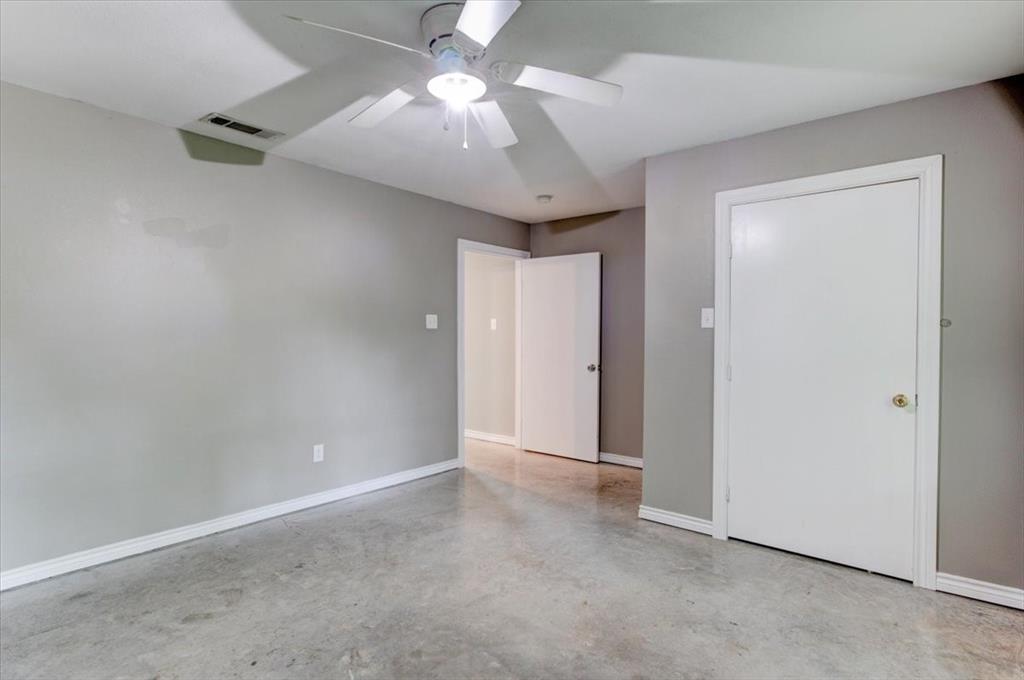3558 Winston Road Fort Worth, TX 76109 - Photo 15 of 24 an empty room with a ceiling fan and a chandelier fan
