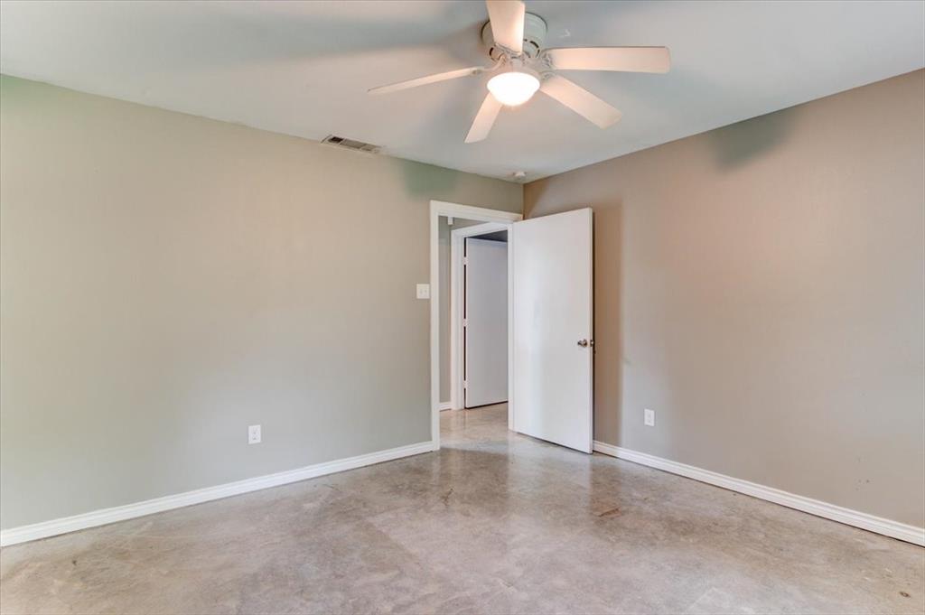 3558 Winston Road Fort Worth, TX 76109 - Photo 17 of 24 an empty room with a chandelier fan and closet area