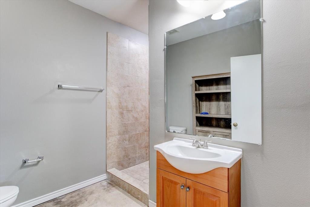 3558 Winston Road Fort Worth, TX 76109 - Photo 20 of 24 a bathroom with a sink a toilet and shower