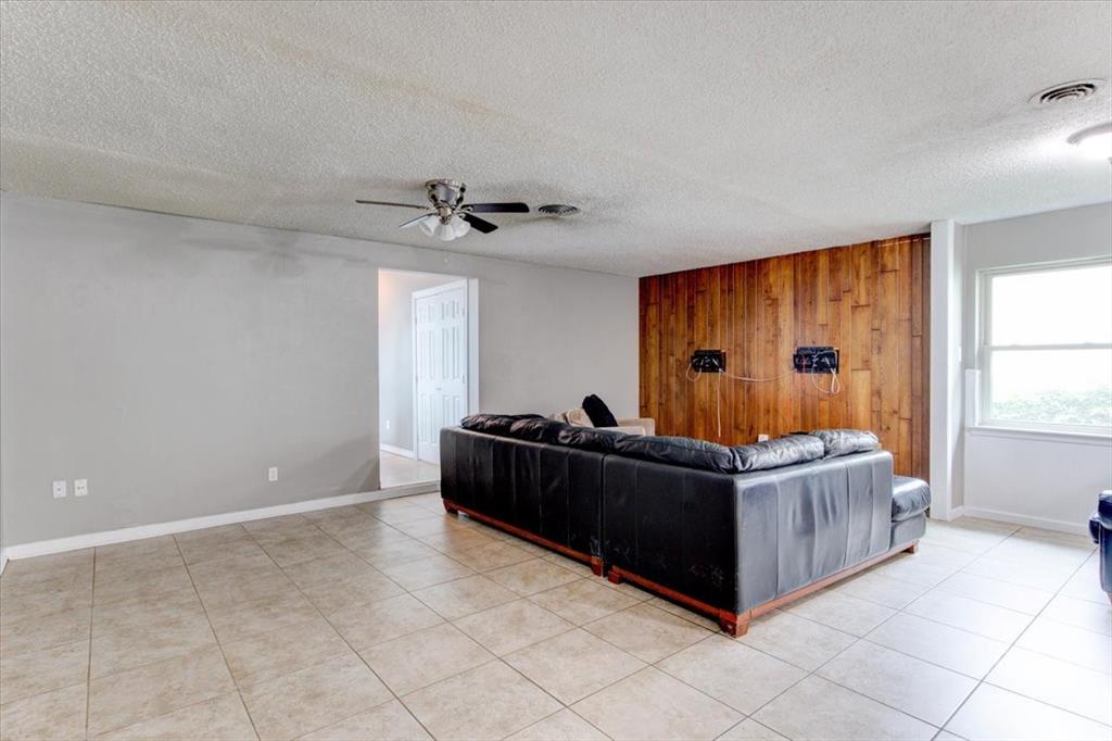 3558 Winston Road Fort Worth, TX 76109 - Photo 10 of 24 a living room with a couch and a window