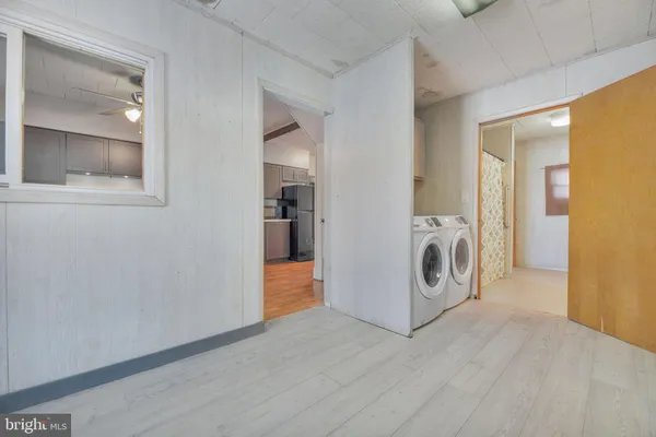 a view of a kitchen with washer and dryer