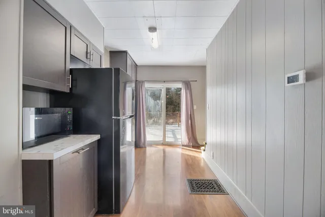 a close view of a stove a microwave and cabinets