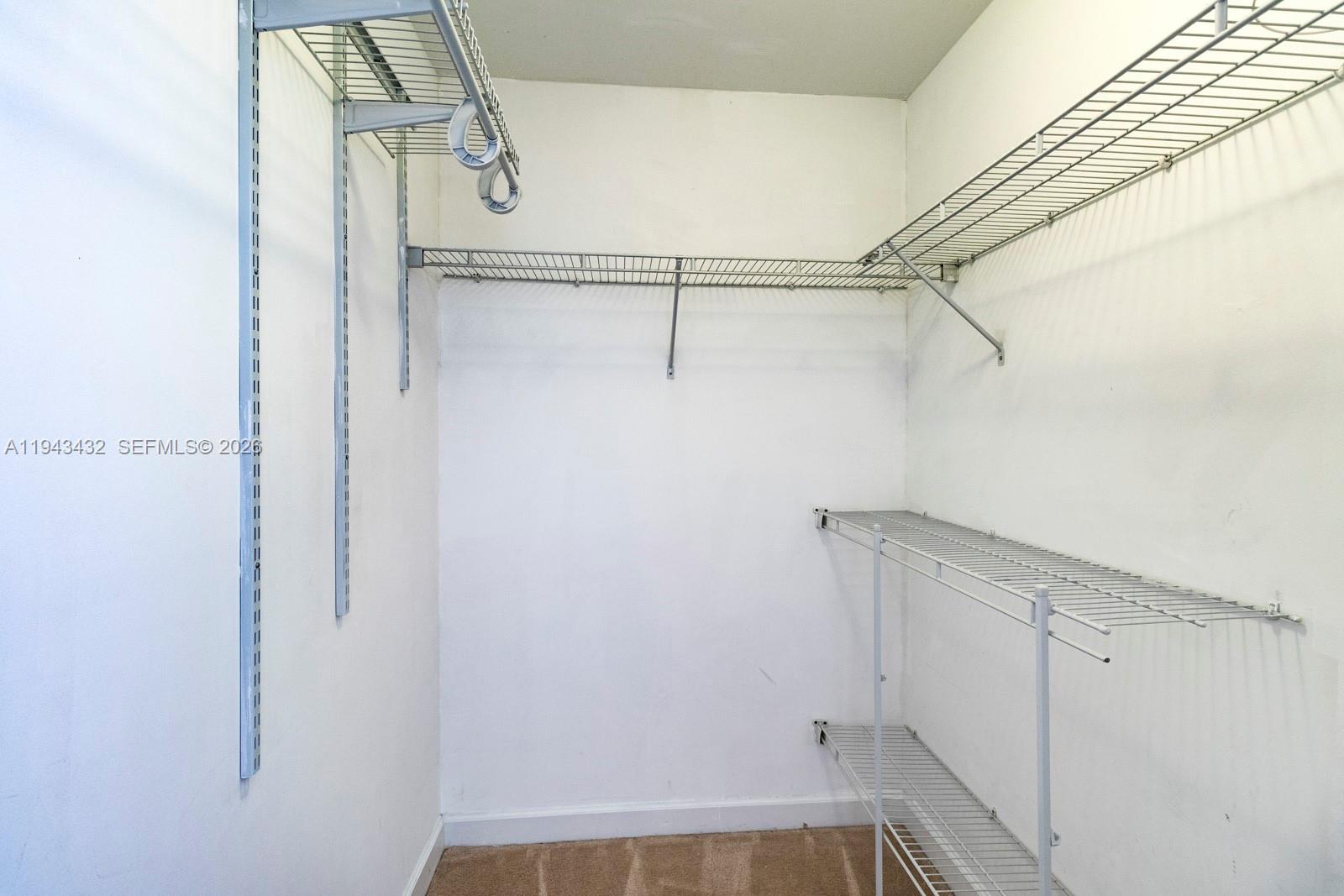 8395 Southwest 73rd Avenue, Unit 528 Miami, FL 33143 - Photo 15 of 27 a view of a room with racks on the wall