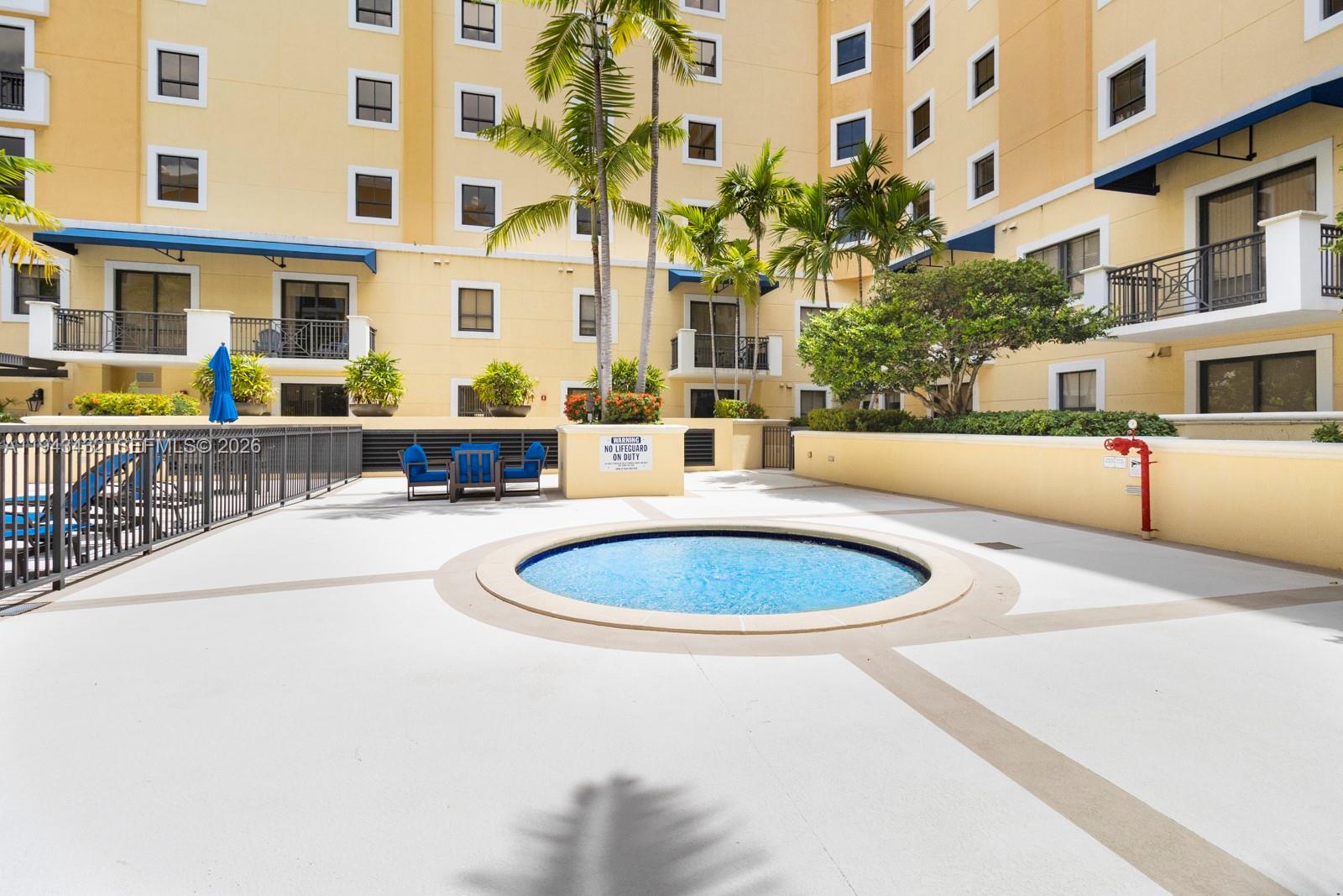 8395 Southwest 73rd Avenue, Unit 528 Miami, FL 33143 - Photo 19 of 27 a view of a swimming pool with outdoor seating
