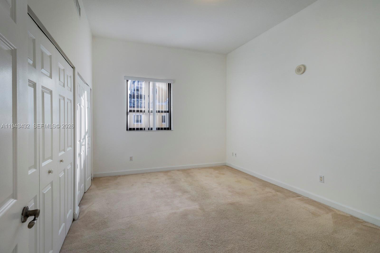 8395 Southwest 73rd Avenue, Unit 528 Miami, FL 33143 - Photo 9 of 27 an empty room with windows