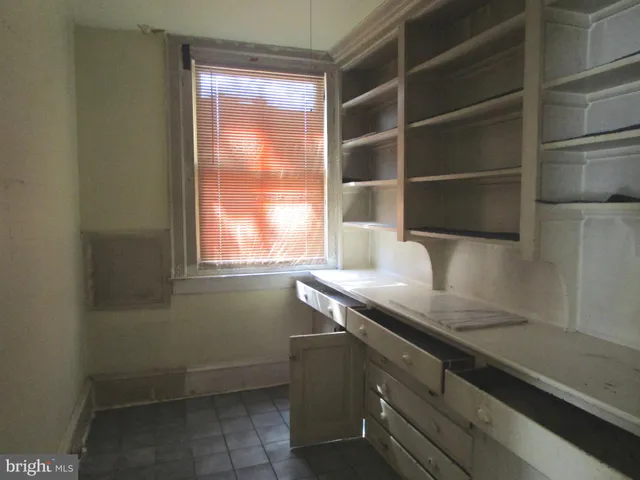 a kitchen with a sink and a window