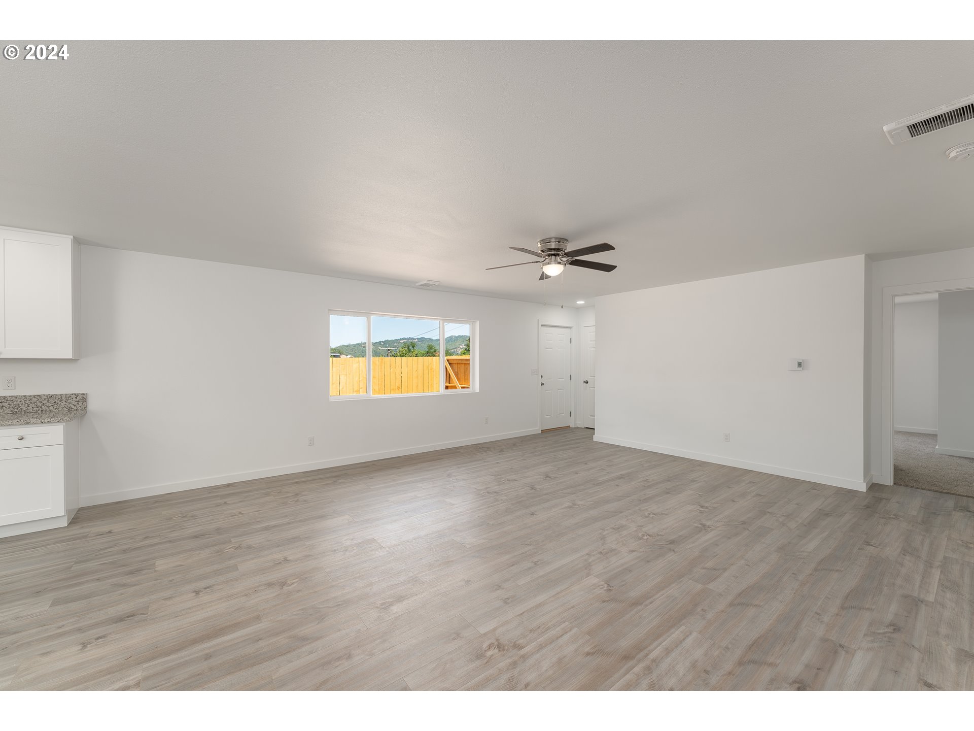 1237 Southeast Washington Avenue Roseburg, OR 97470 - Photo 11 of 28 a view of an empty room and a window