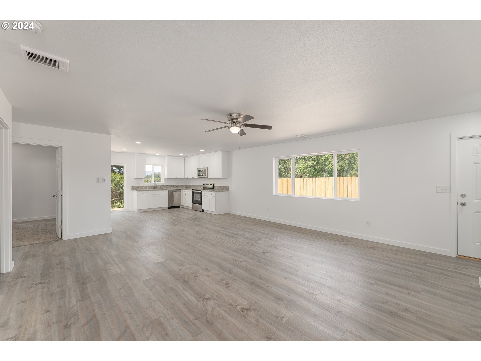 1237 Southeast Washington Avenue Roseburg, OR 97470 - Photo 13 of 28 a view of empty room with wooden floor