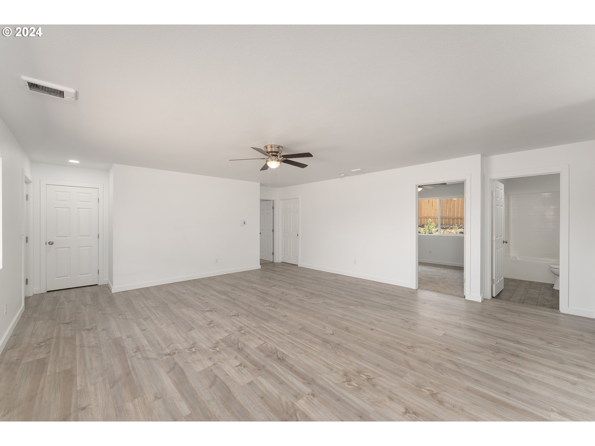 1237 Southeast Washington Avenue Roseburg, OR 97470 - Photo 10 of 28 a view of an empty room with wooden floor