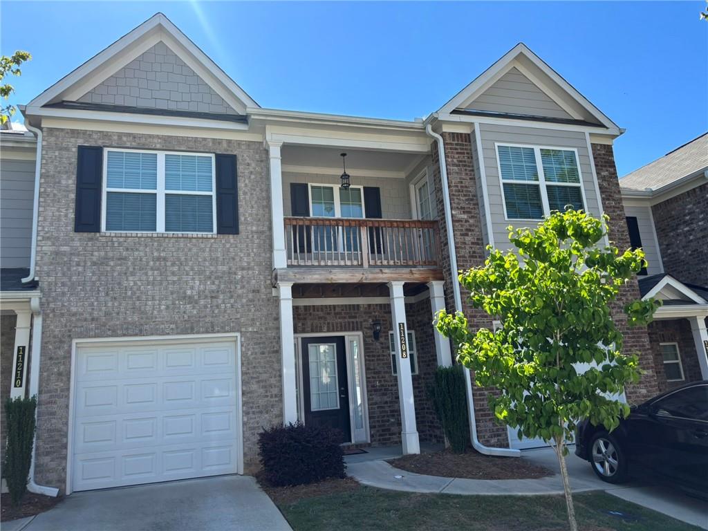 11208 Benton Loop Covington, GA 30014 - Photo 2 of 16 a front view of a house with a yard