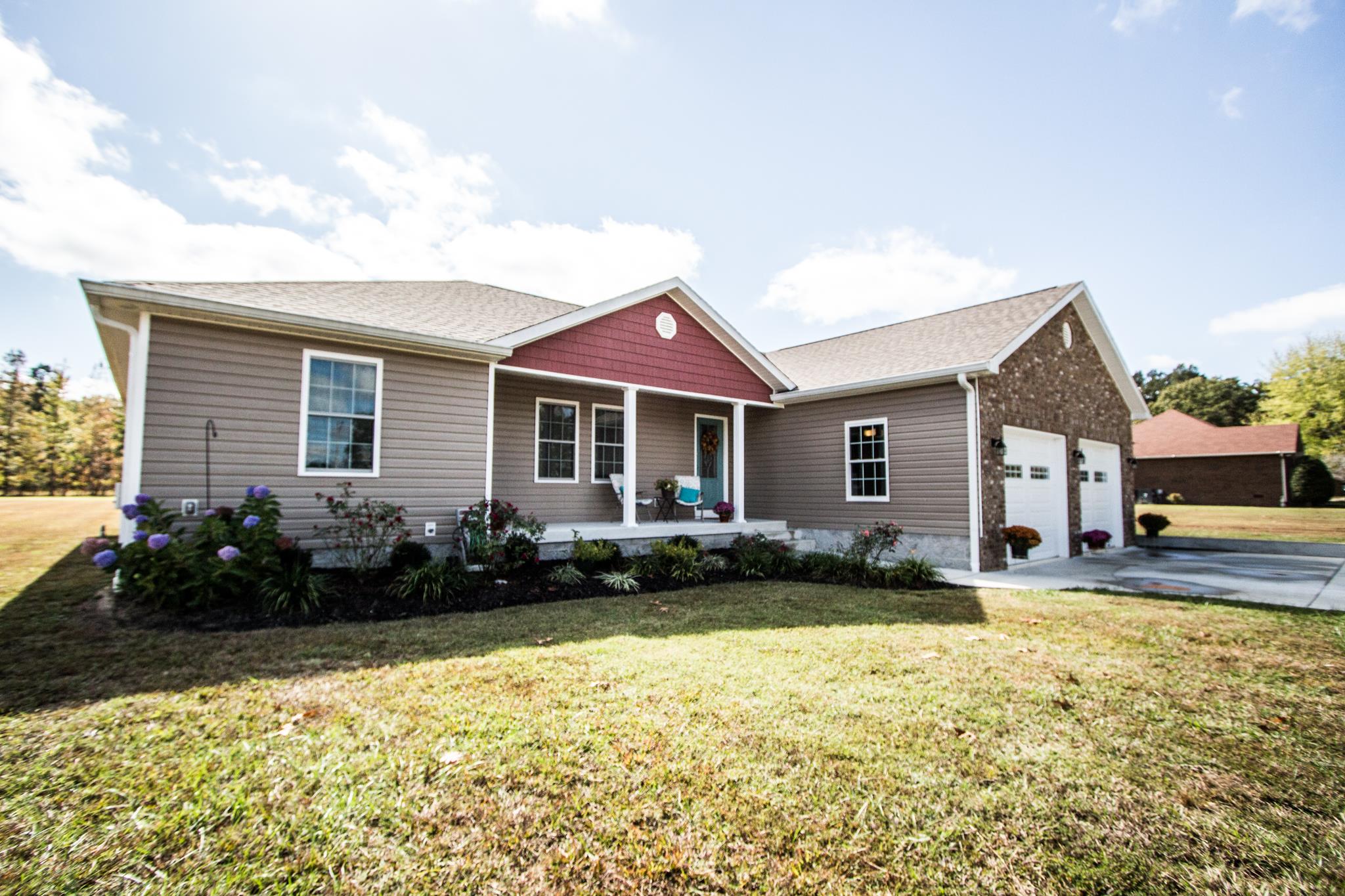 2082 Wayside Road Manchester, TN 37355 - Photo 2 of 30 a front view of a house with a garden
