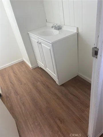 a white toilet sitting next to a bath tub
