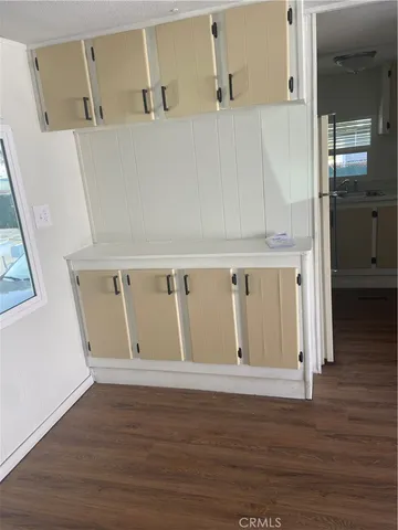 a kitchen with granite countertop a sink and a stove top oven