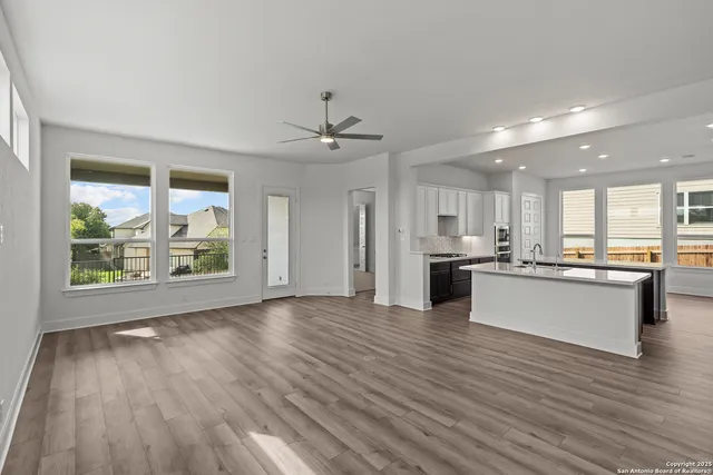 a view of kitchen with wooden floor and outdoor space
