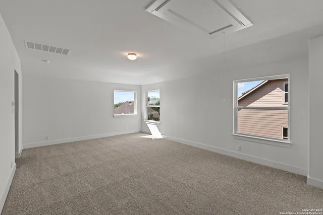 a view of empty room with windows