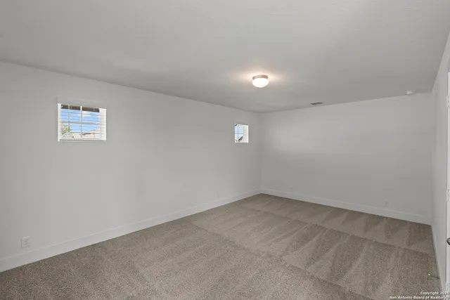 an empty room with a empty space and window