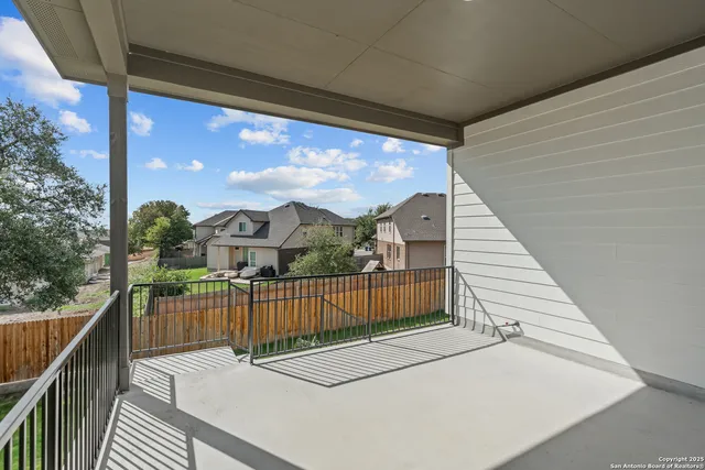 a view of a balcony with wooden floor
