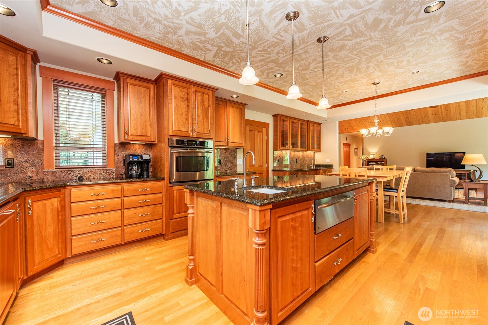 1065 Henry Boyd Road Port Angeles, WA 98362 - Photo 13 of 40 a large kitchen with stainless steel appliances granite countertop a large stove a sink and dishwasher