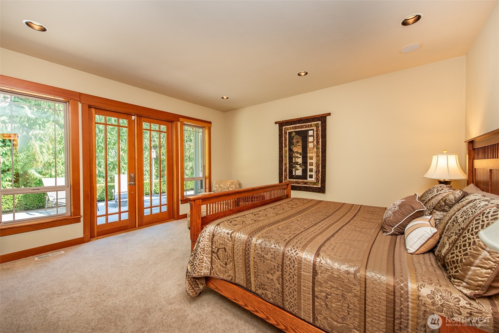 1065 Henry Boyd Road Port Angeles, WA 98362 - Photo 16 of 40 a bedroom with a large bed and a large window