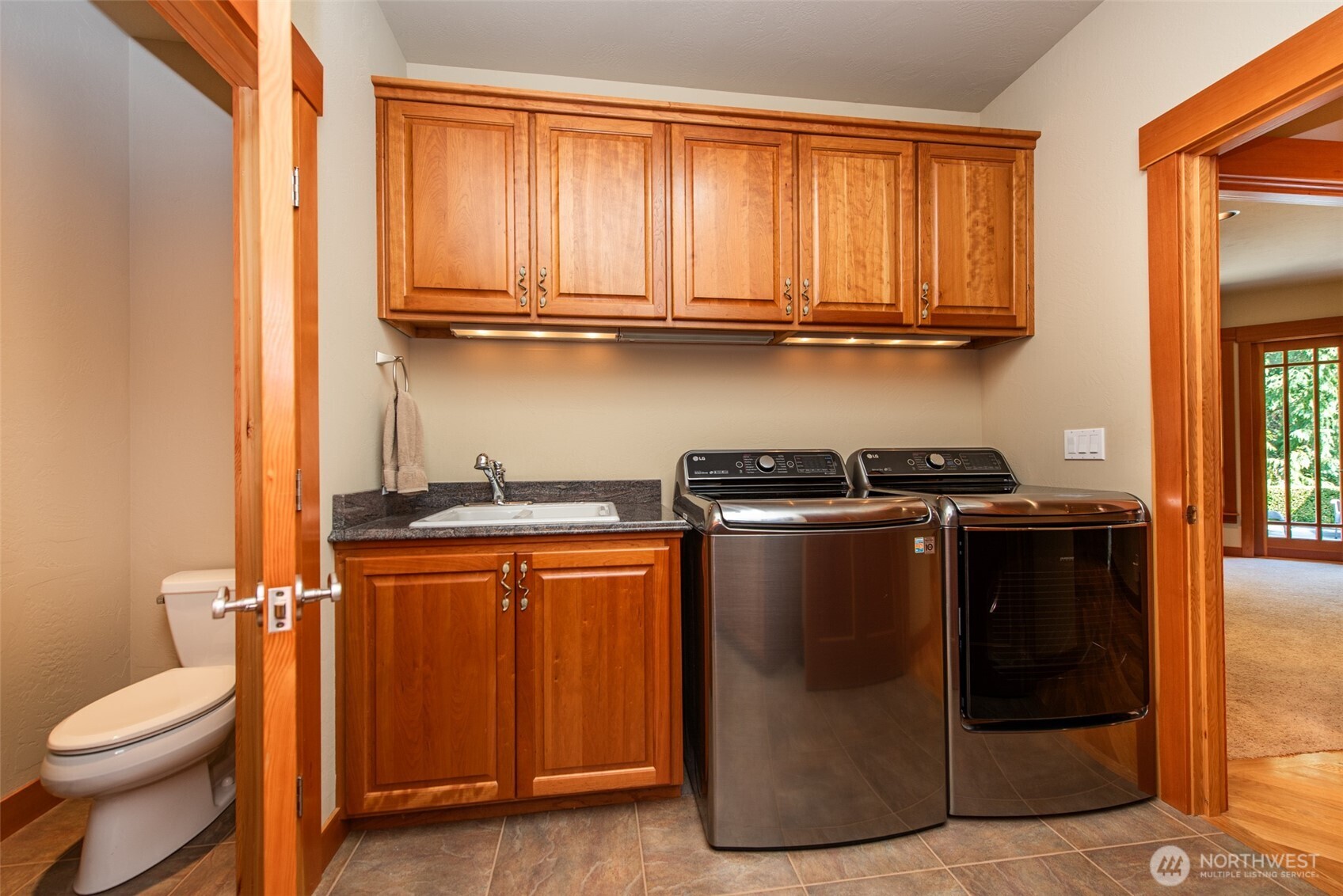 1065 Henry Boyd Road Port Angeles, WA 98362 - Photo 23 of 40 a view of a kitchen with stainless steel appliances granite countertop a refrigerator and a sink