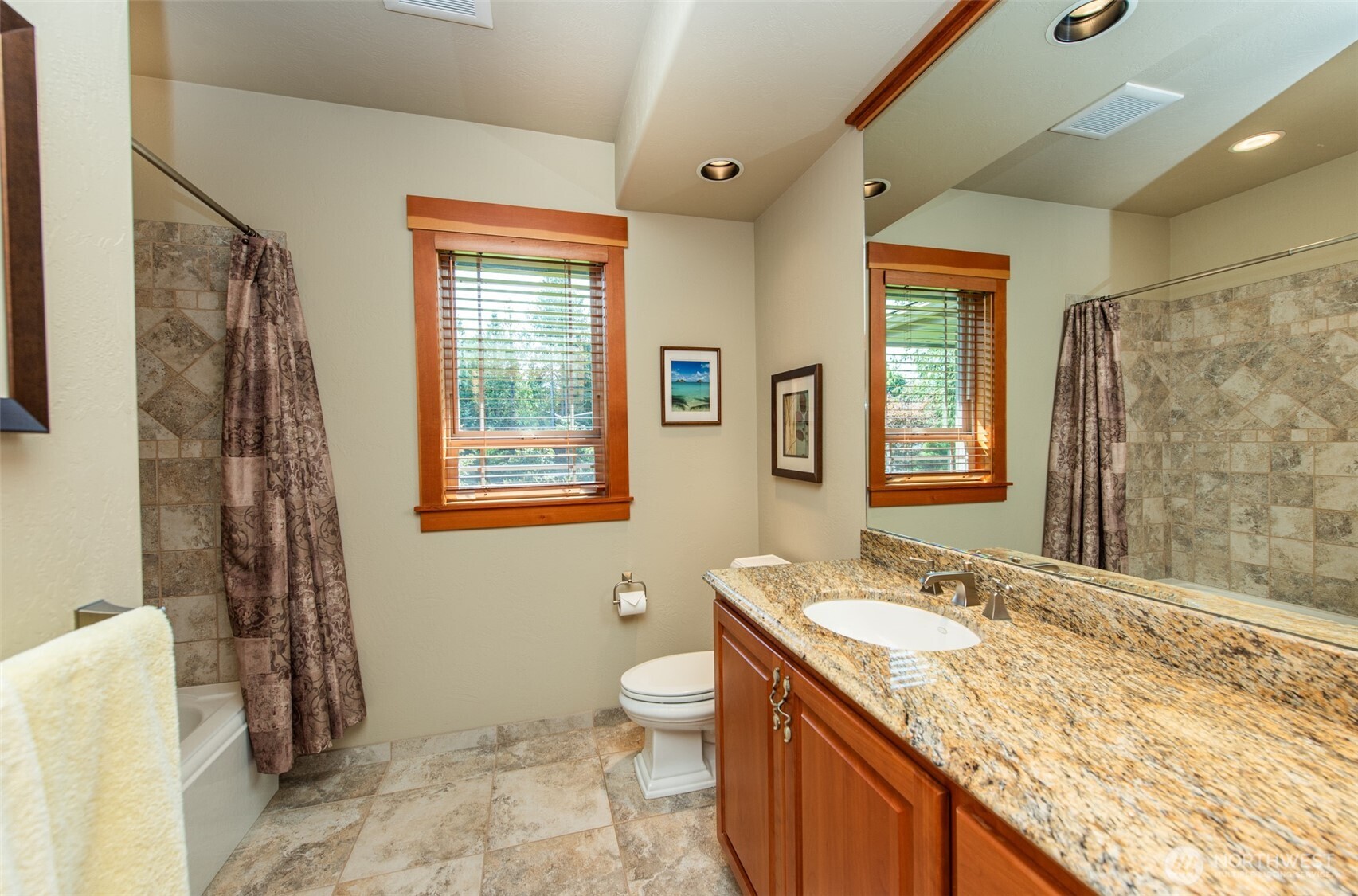 1065 Henry Boyd Road Port Angeles, WA 98362 - Photo 26 of 40 a bathroom with a granite countertop sink toilet and shower