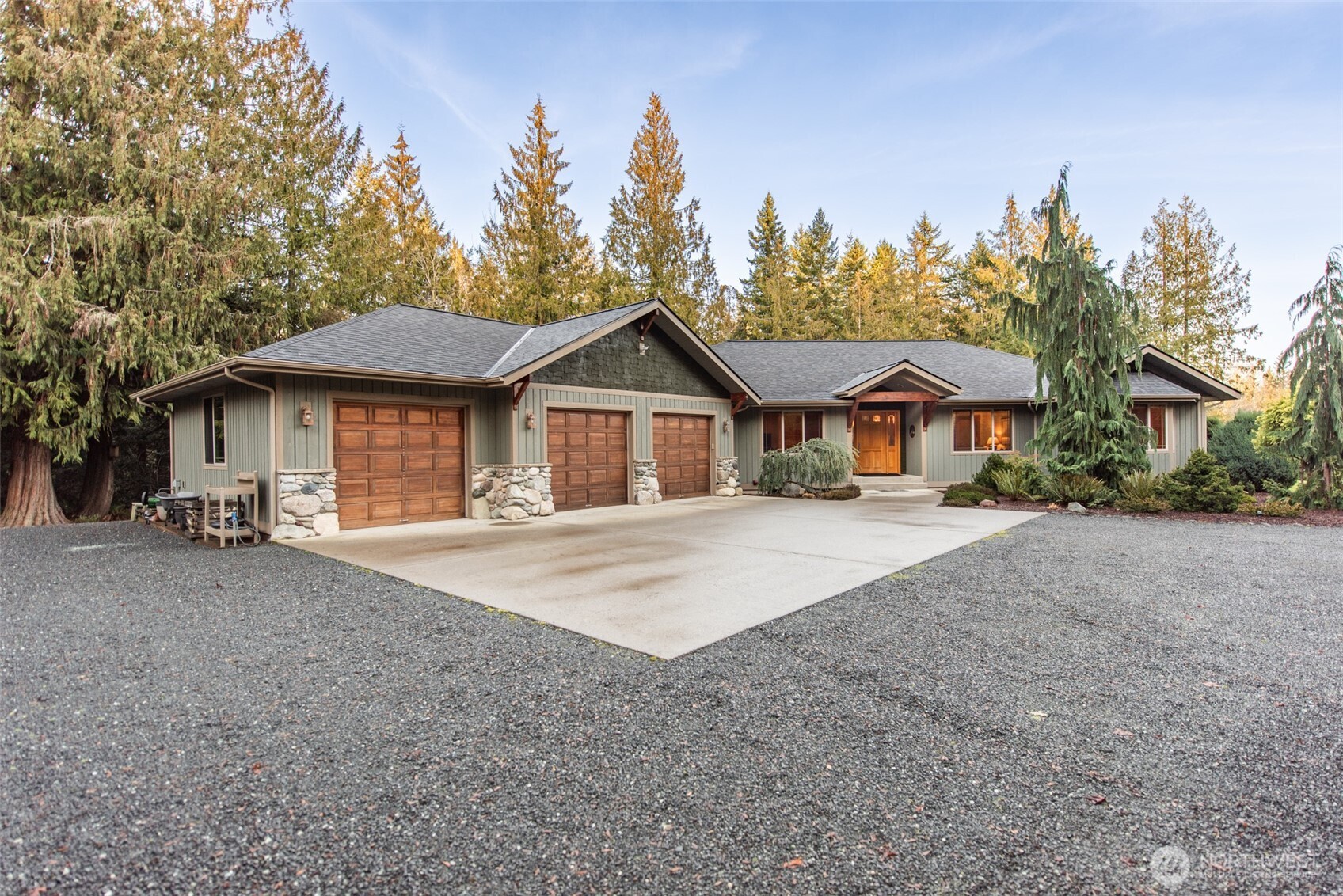 1065 Henry Boyd Road Port Angeles, WA 98362 - Photo 28 of 40 a front view of a house with a garden and trees