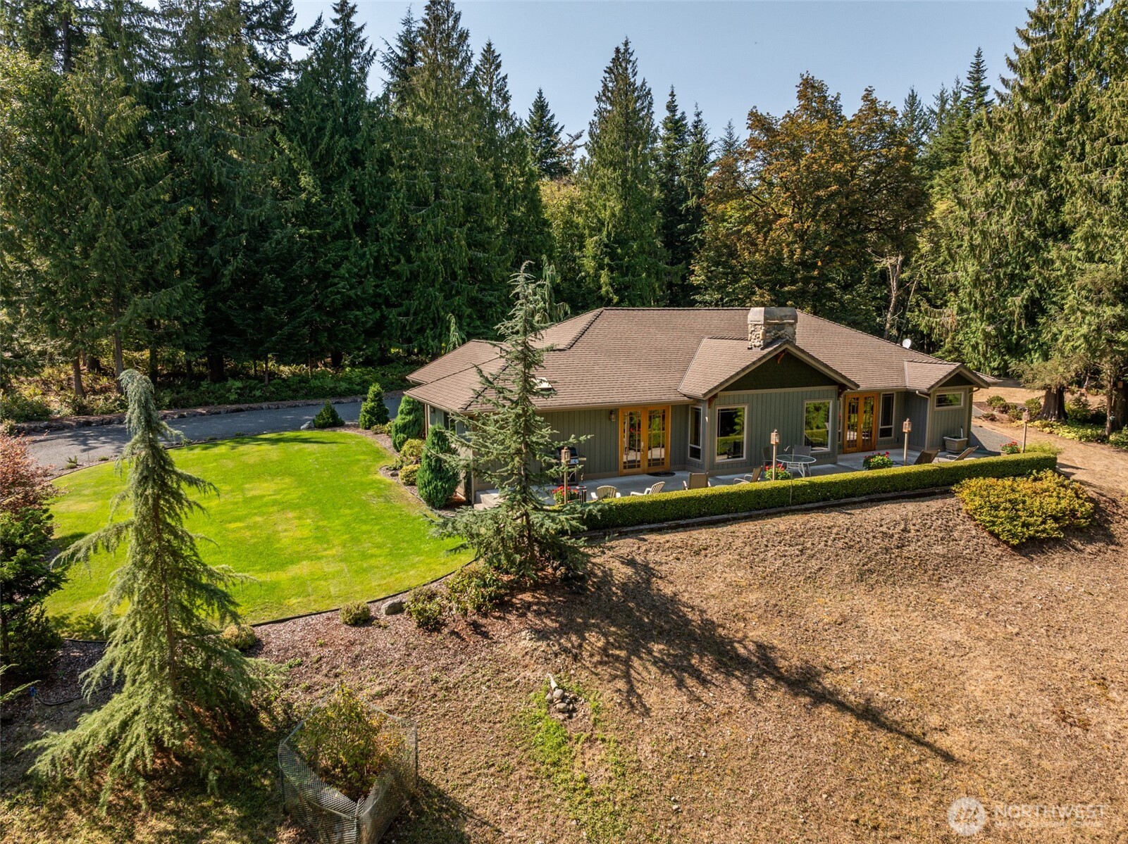 1065 Henry Boyd Road Port Angeles, WA 98362 - Photo 34 of 40 a view of a house with pool yard and sitting area