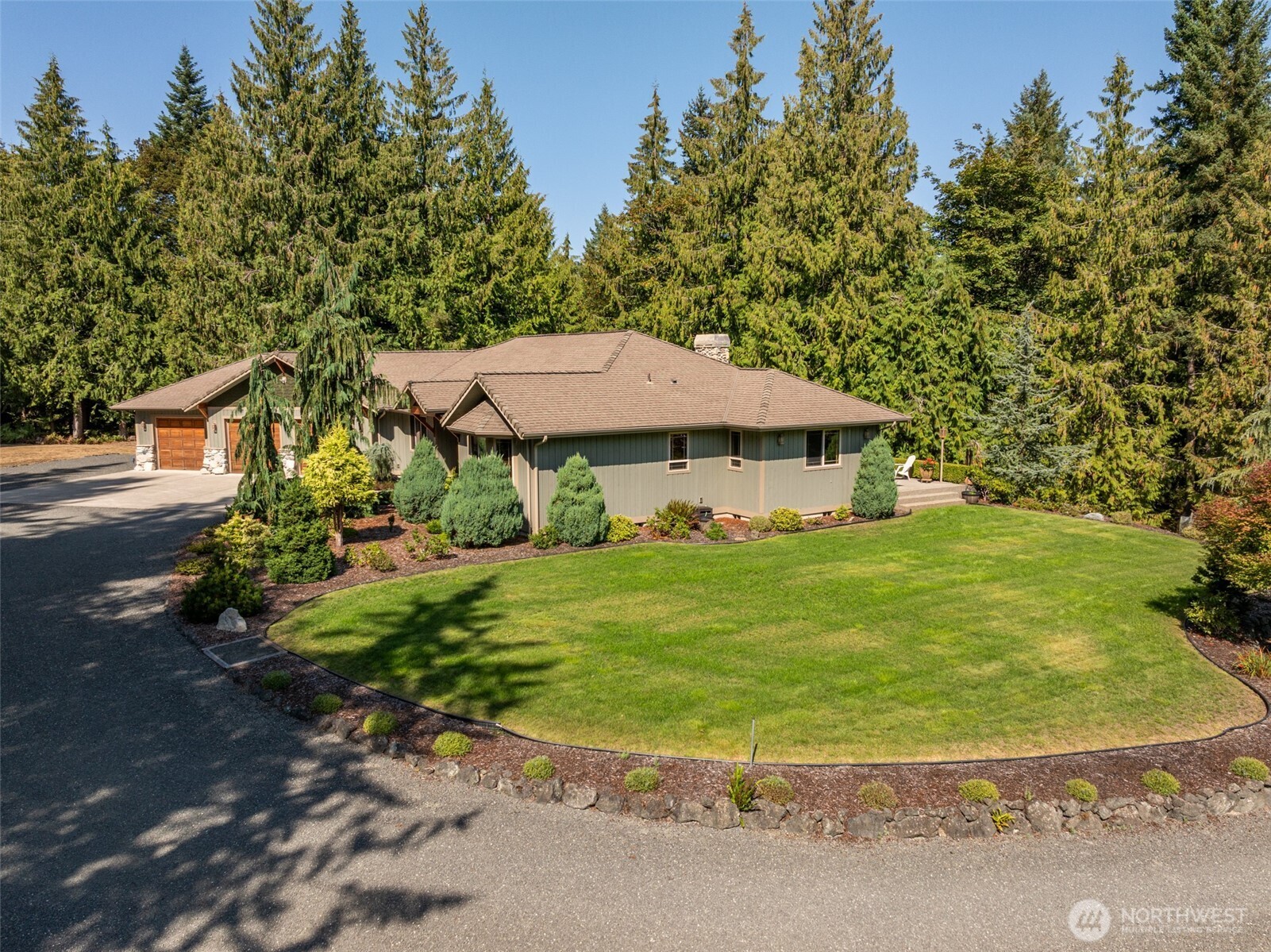 1065 Henry Boyd Road Port Angeles, WA 98362 - Photo 35 of 40 a view of a house with a yard and sitting area