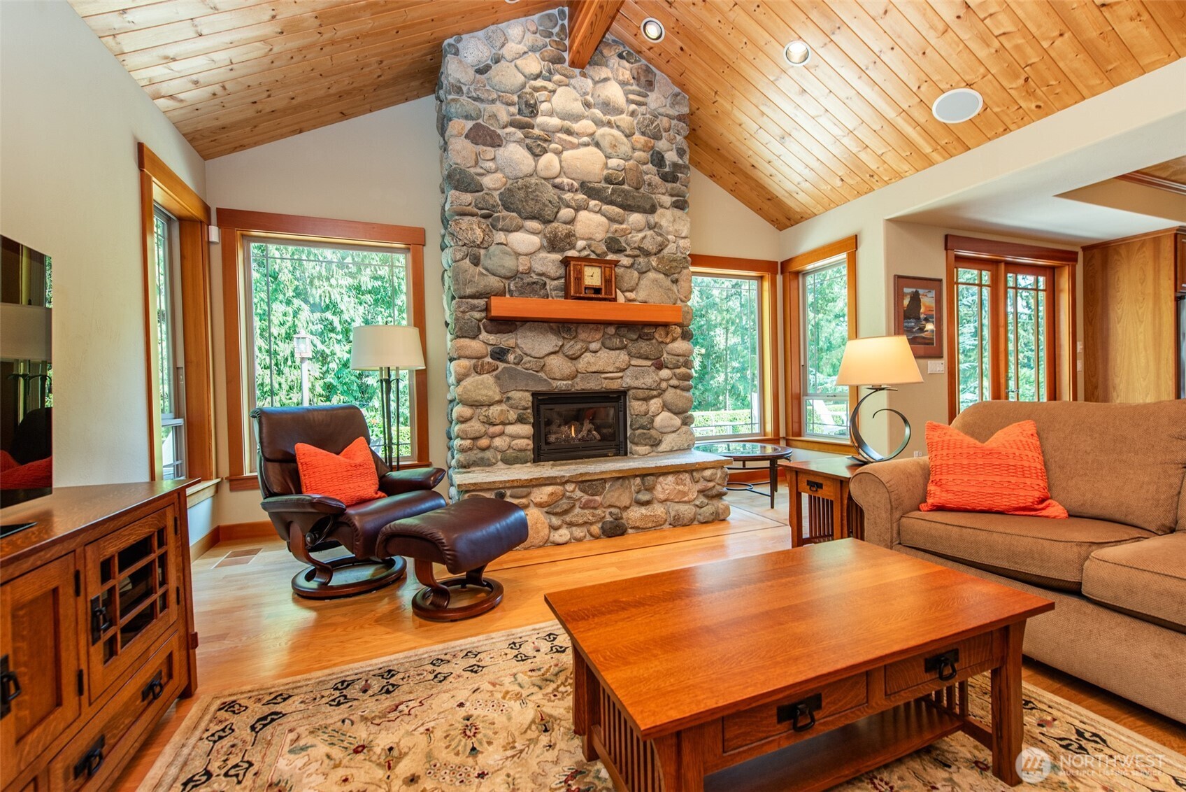 1065 Henry Boyd Road Port Angeles, WA 98362 - Photo 9 of 40 a living room with furniture fireplace and a large window