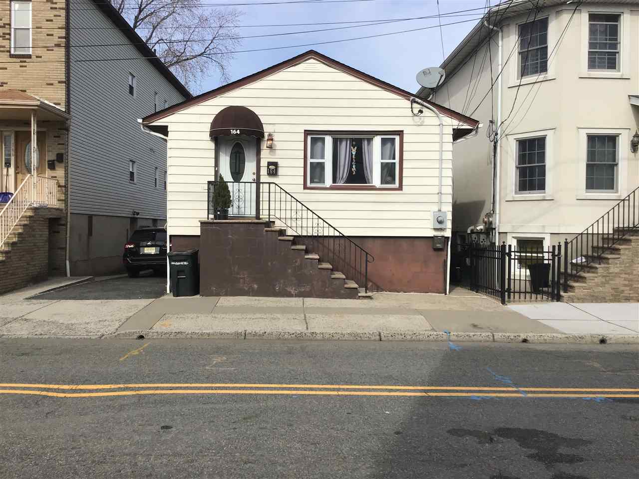 164 Front Street Secaucus, NJ 07094 - Photo 1 of 1 a front view of a house with yard