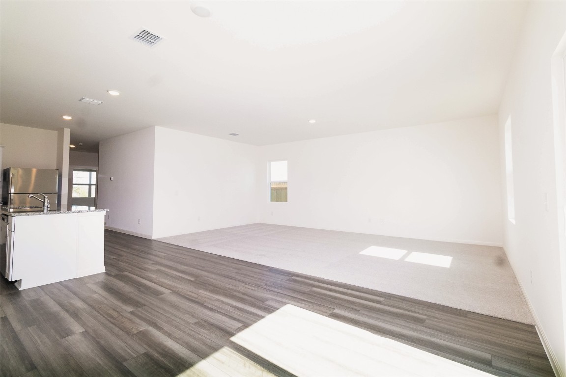 1524 Morris Loop San Marcos, TX 78666 - Photo 20 of 25 a view of kitchen and hall with wooden floor