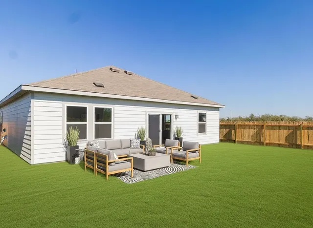 a view of a house with backyard porch and sitting area