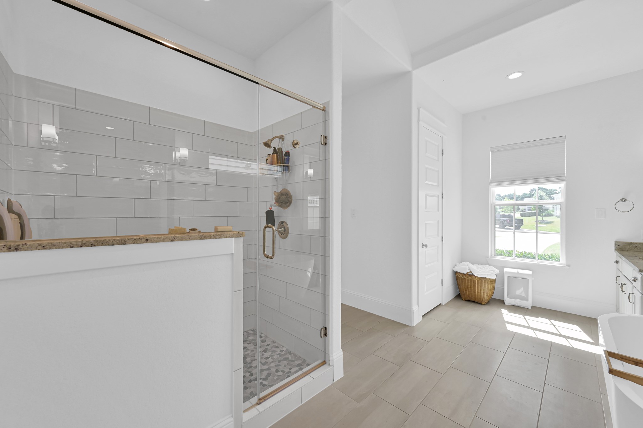 2333 Goldenglade Drive Conroe, TX 77384 - Photo 19 of 45 Gorgeous walk-in-shower. The primary closet is located through the hallway just beyond the shower.