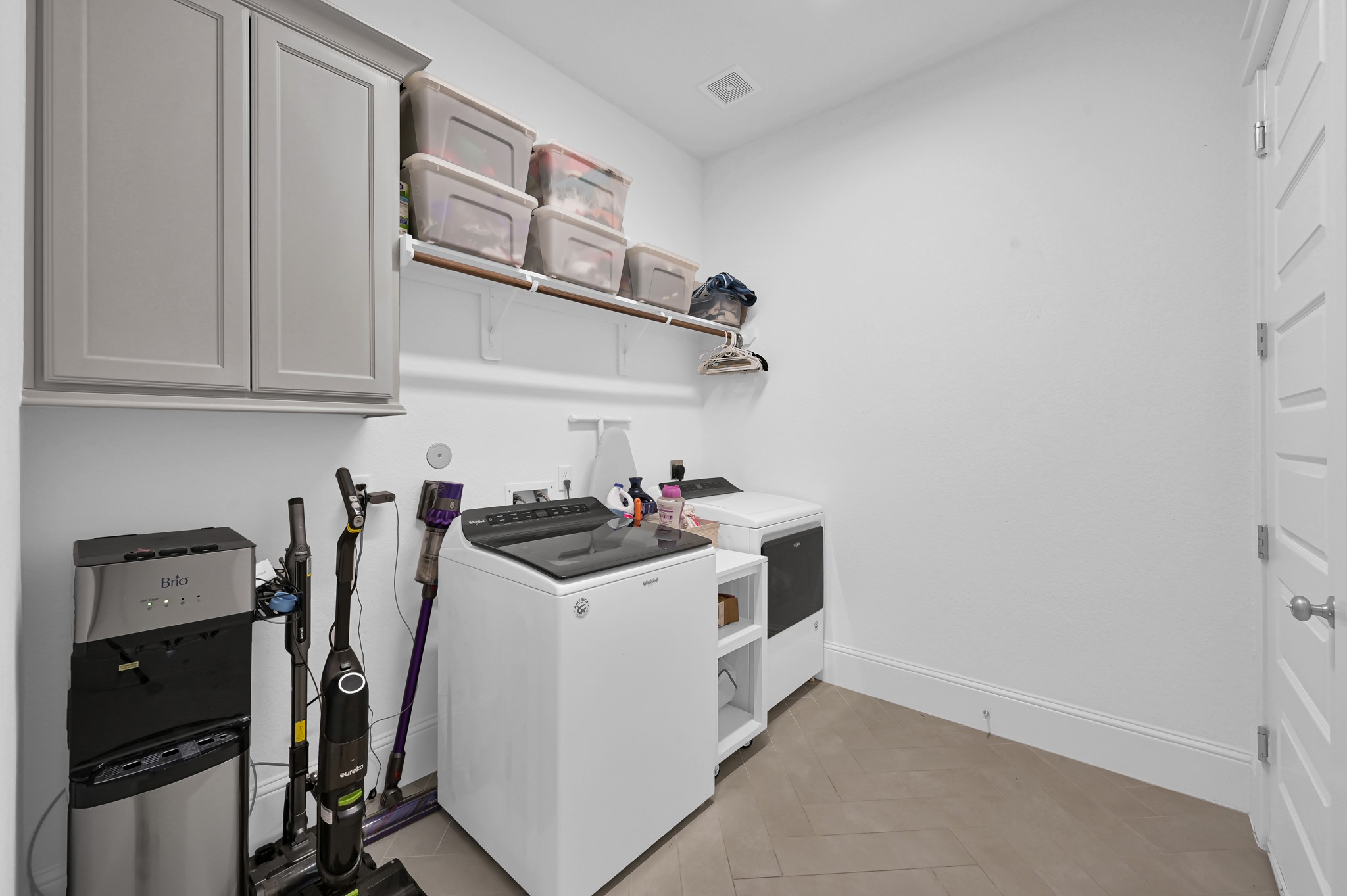 2333 Goldenglade Drive Conroe, TX 77384 - Photo 34 of 45 Sizeable utility room (located downstairs) with access to the three-car garage.