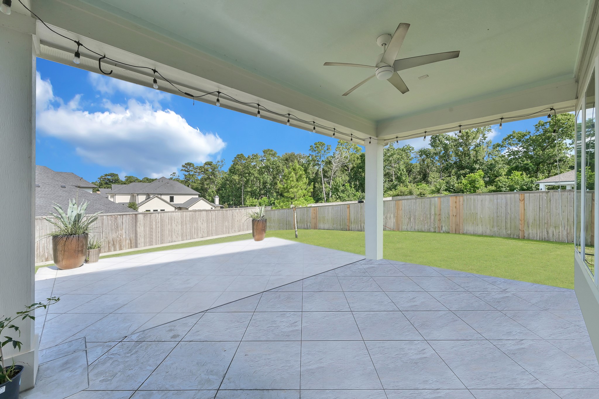 2333 Goldenglade Drive Conroe, TX 77384 - Photo 35 of 45 Large, covered patio with uncovered extension.
