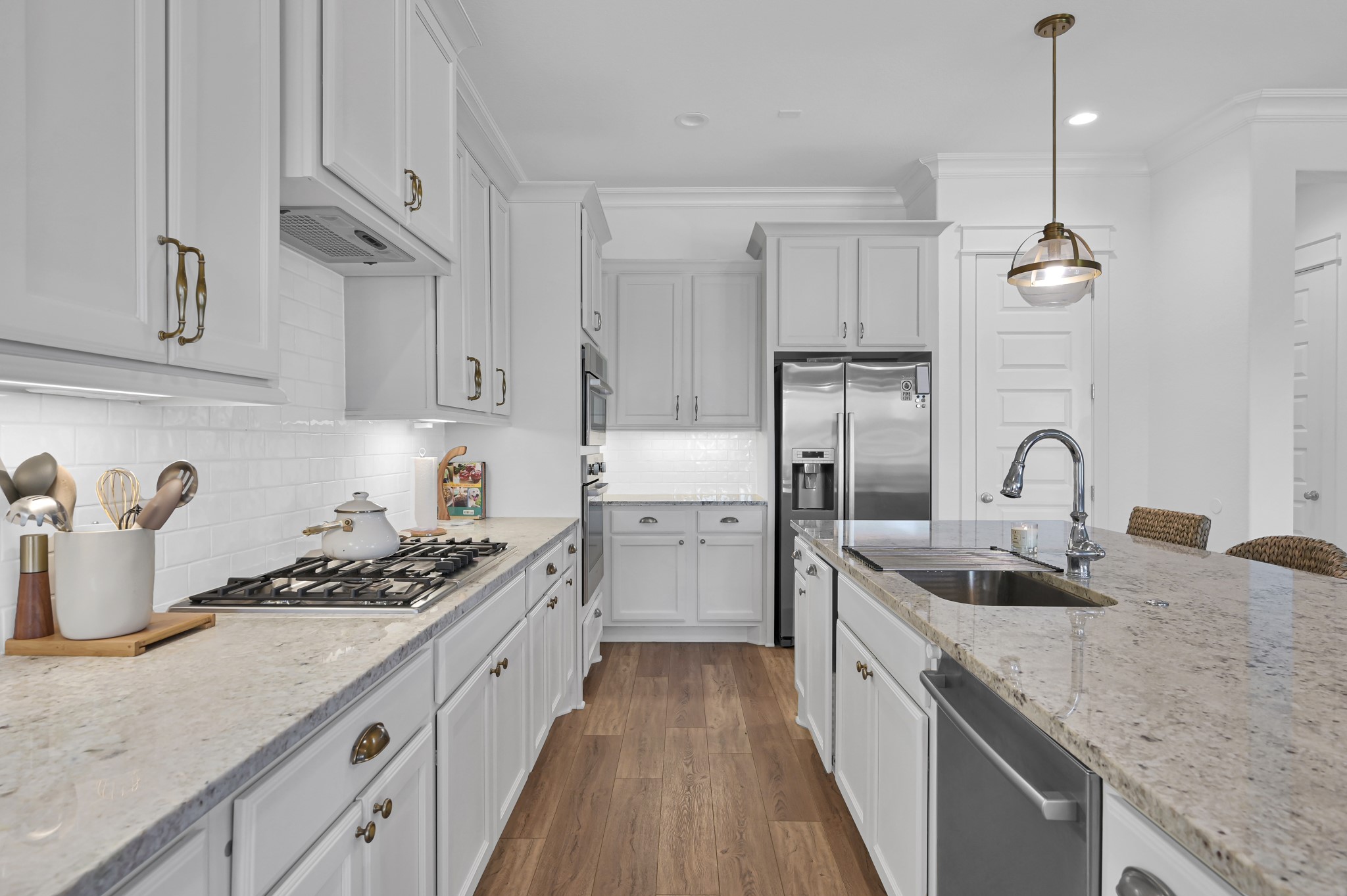 2333 Goldenglade Drive Conroe, TX 77384 - Photo 9 of 45 Light and bright kitchen with crisp white cabinets, natural light and an open/airy feeling.