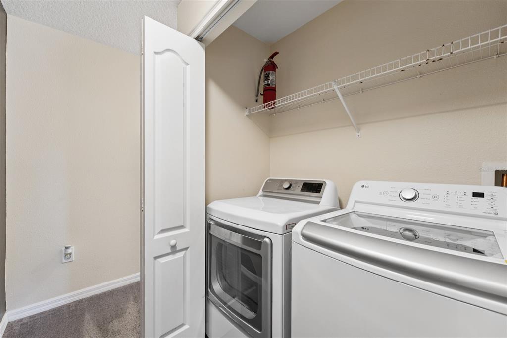 4841 Clock Tower Drive Kissimmee, FL 34746 - Photo 19 of 36 a utility room with dryer and washer