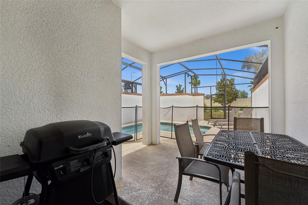 4841 Clock Tower Drive Kissimmee, FL 34746 - Photo 23 of 36 a view of a dining room with furniture and a window