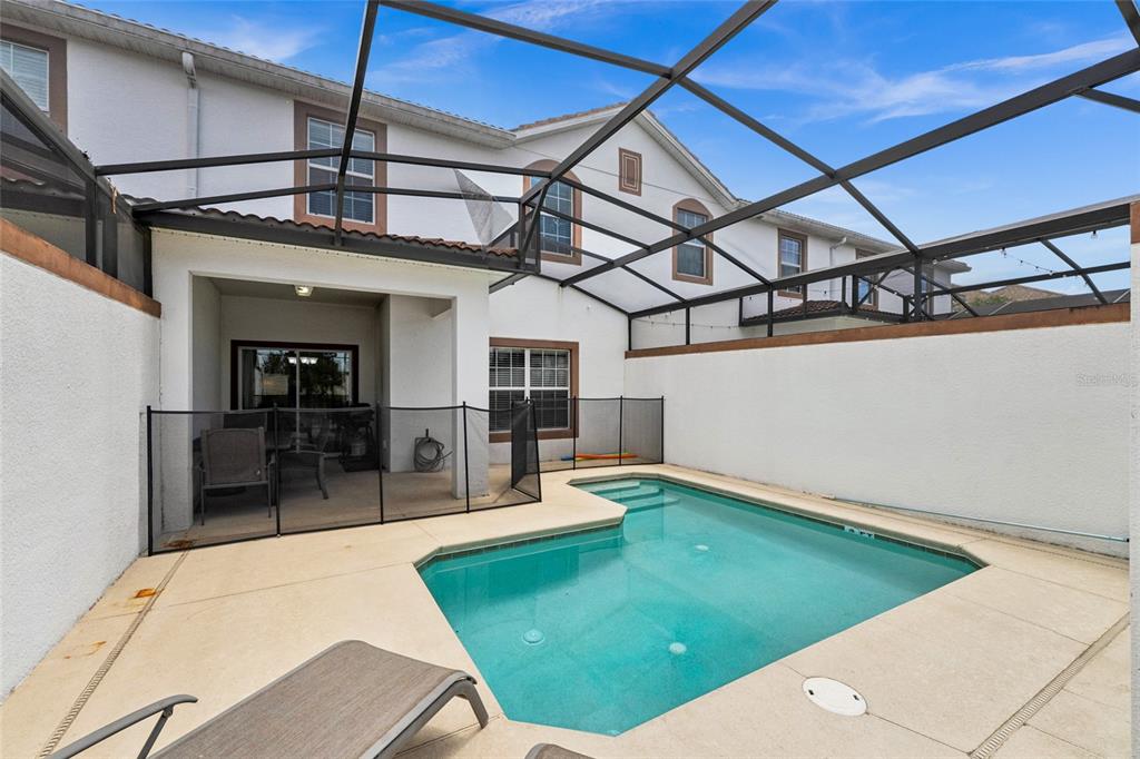 4841 Clock Tower Drive Kissimmee, FL 34746 - Photo 25 of 36 a view of a patio with a tv