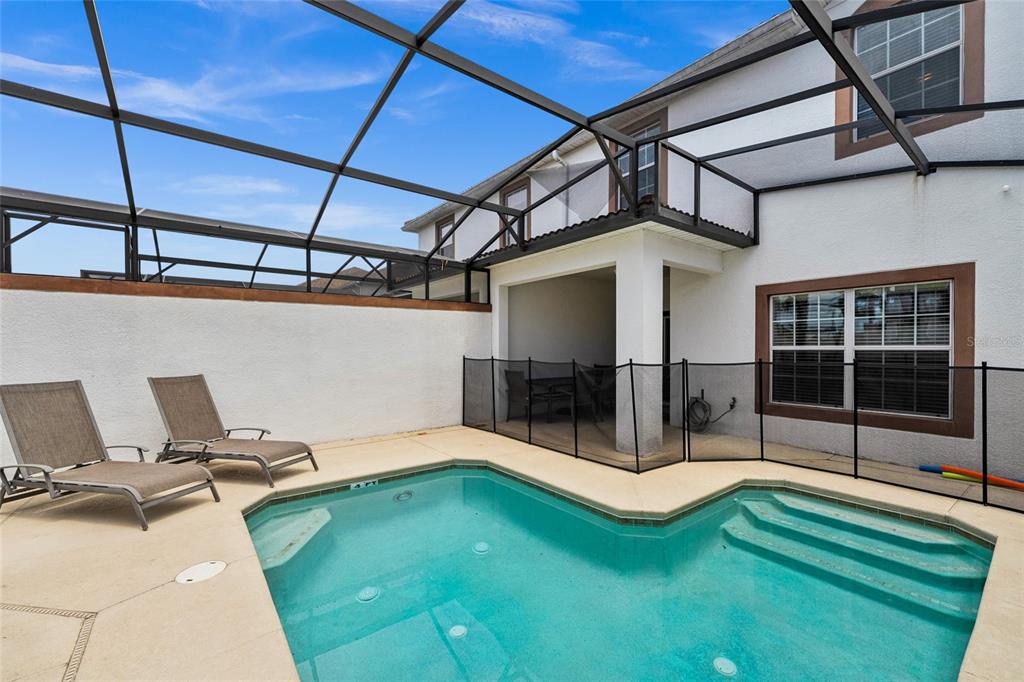 4841 Clock Tower Drive Kissimmee, FL 34746 - Photo 26 of 36 a view of a patio with a table and chairs