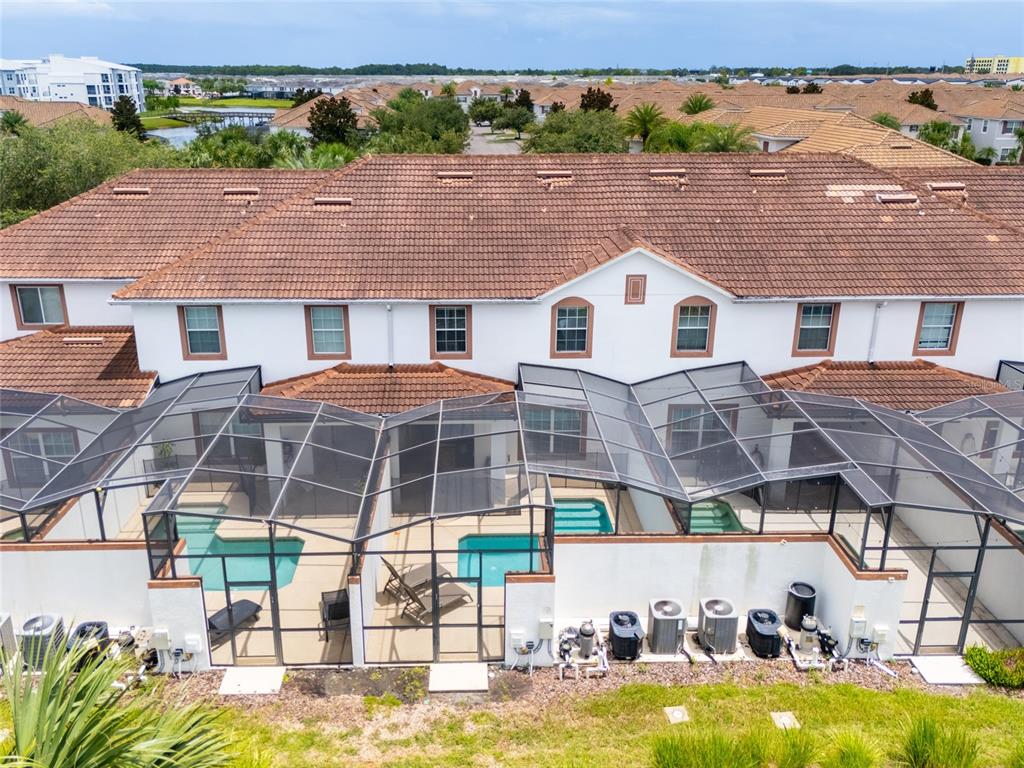 4841 Clock Tower Drive Kissimmee, FL 34746 - Photo 28 of 36 a view of a house with pool and chairs
