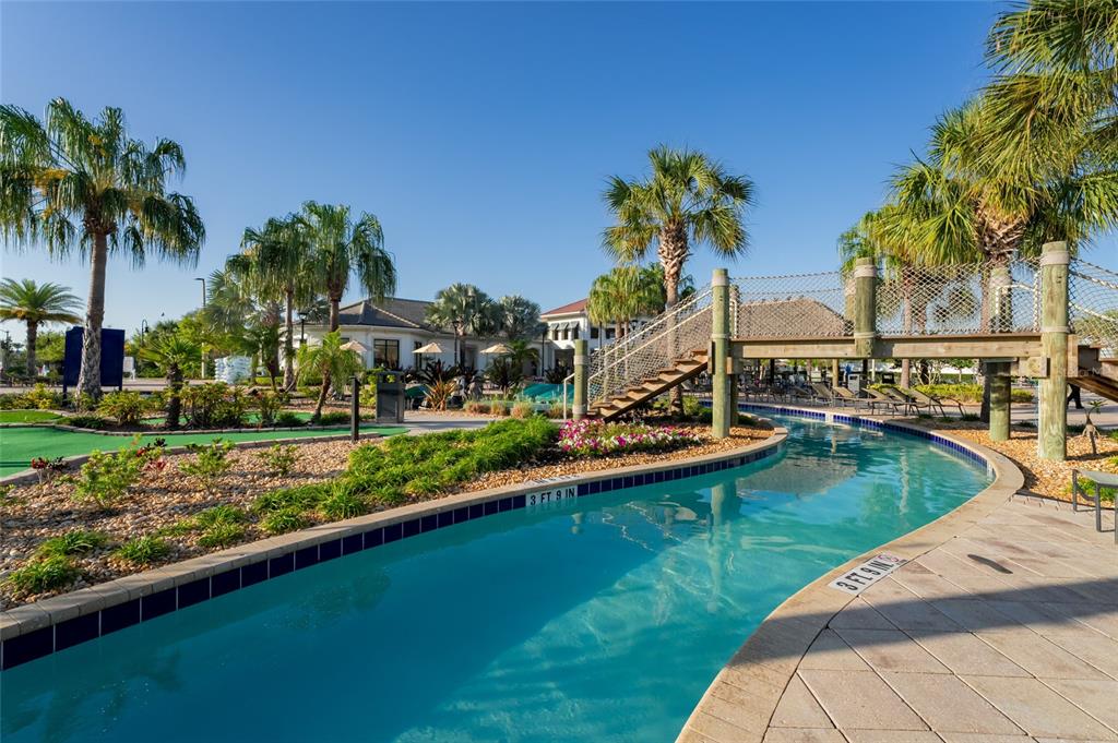 4841 Clock Tower Drive Kissimmee, FL 34746 - Photo 34 of 36 a view of a house with swimming pool and a yard