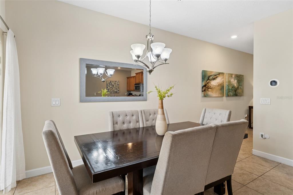 4841 Clock Tower Drive Kissimmee, FL 34746 - Photo 4 of 36 a dining room with furniture and window