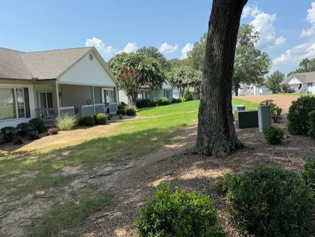 a view of a house with a yard