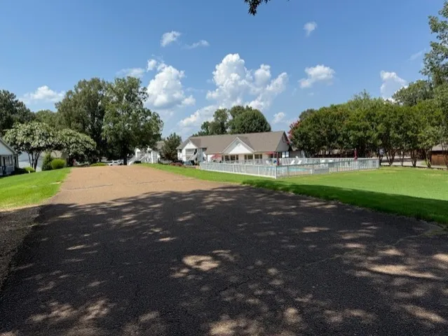 a view of a street both of side of street and trees