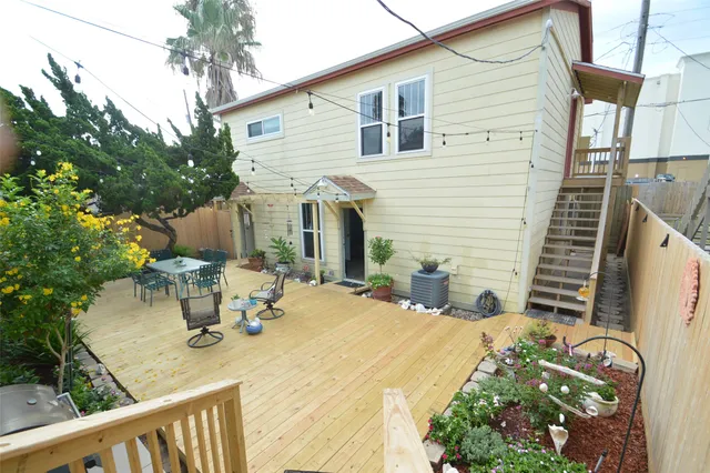 a view of a patio with table and chairs and potted plants