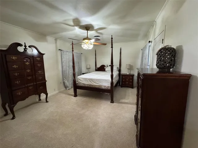a bedroom with double bed and a dresser