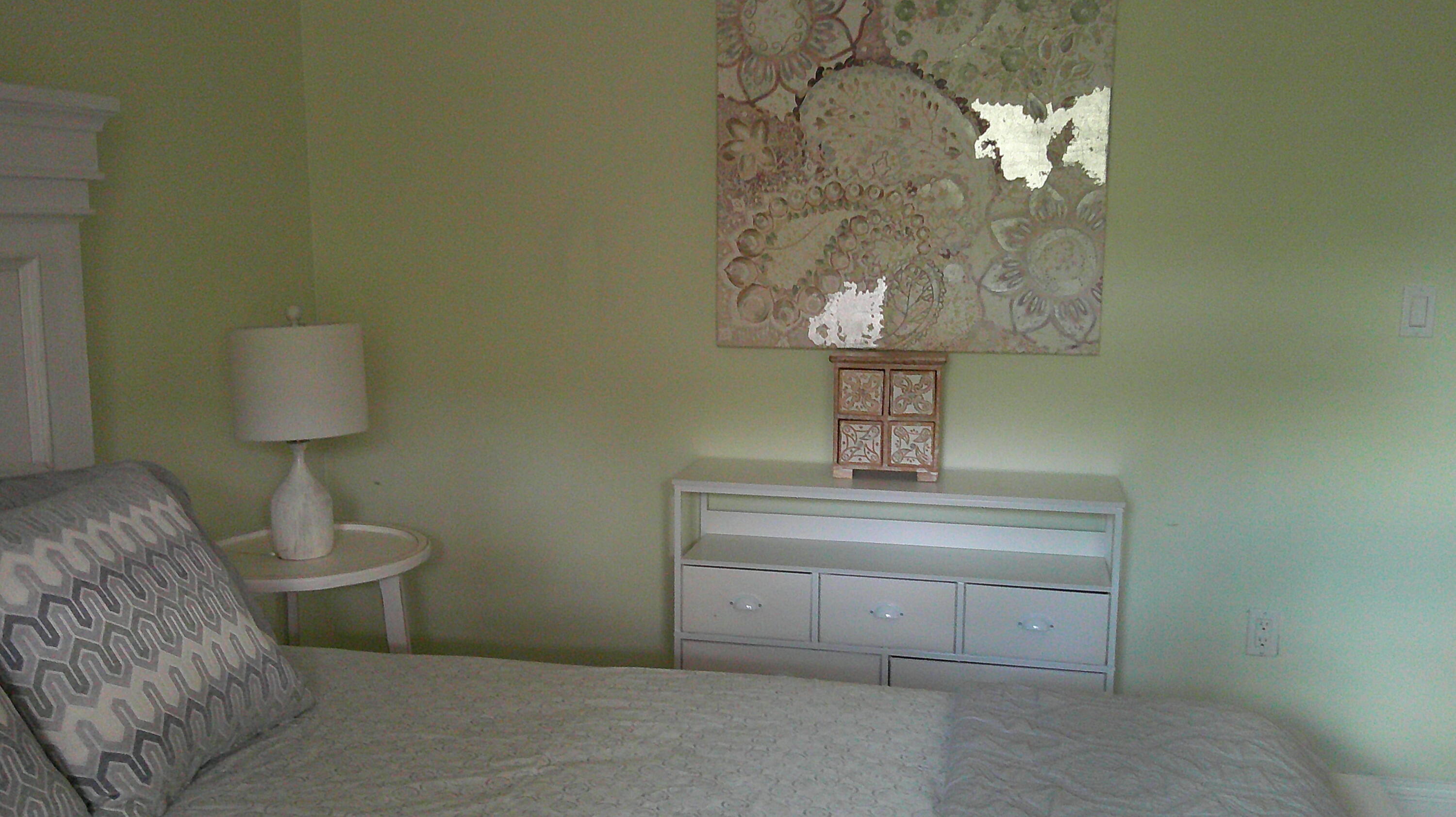 3940 Inverrary Boulevard, Unit 302A Lauderhill, FL 33319 - Photo 12 of 33 a living room with a table and a lamp