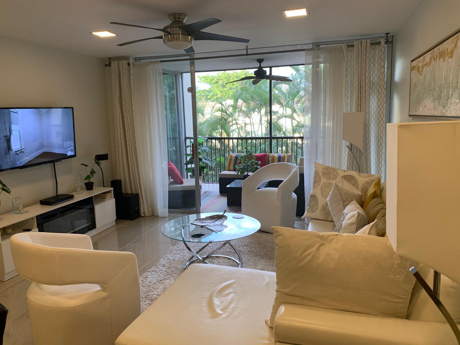 3940 Inverrary Boulevard, Unit 302A Lauderhill, FL 33319 - Photo 28 of 33 a living room with furniture and a large window
