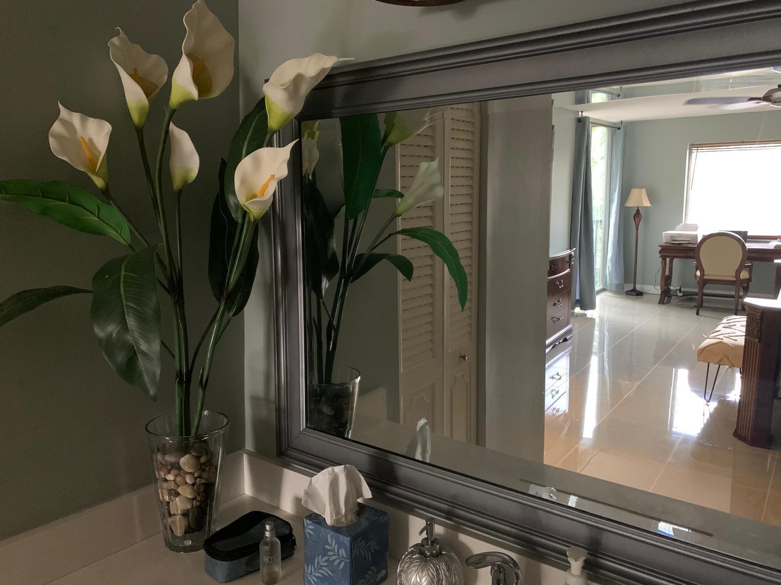 3940 Inverrary Boulevard, Unit 302A Lauderhill, FL 33319 - Photo 29 of 33 a vase of flowers sitting on a table with living room